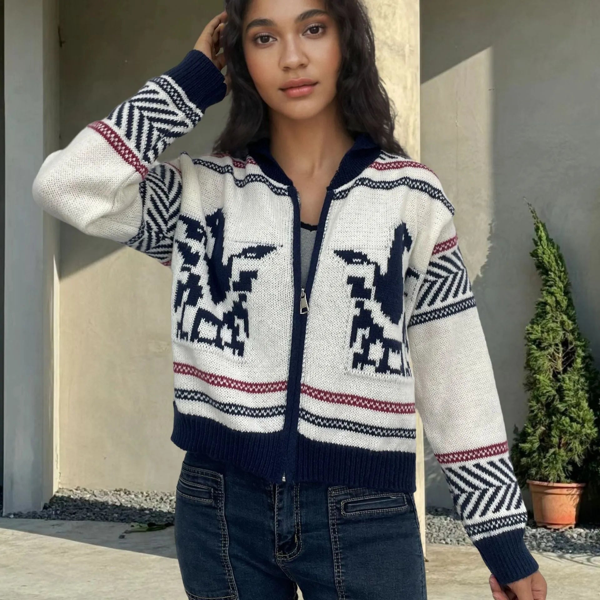 White women's wool zip cardigan with a jacquard contrast colour pattern on the lapel.