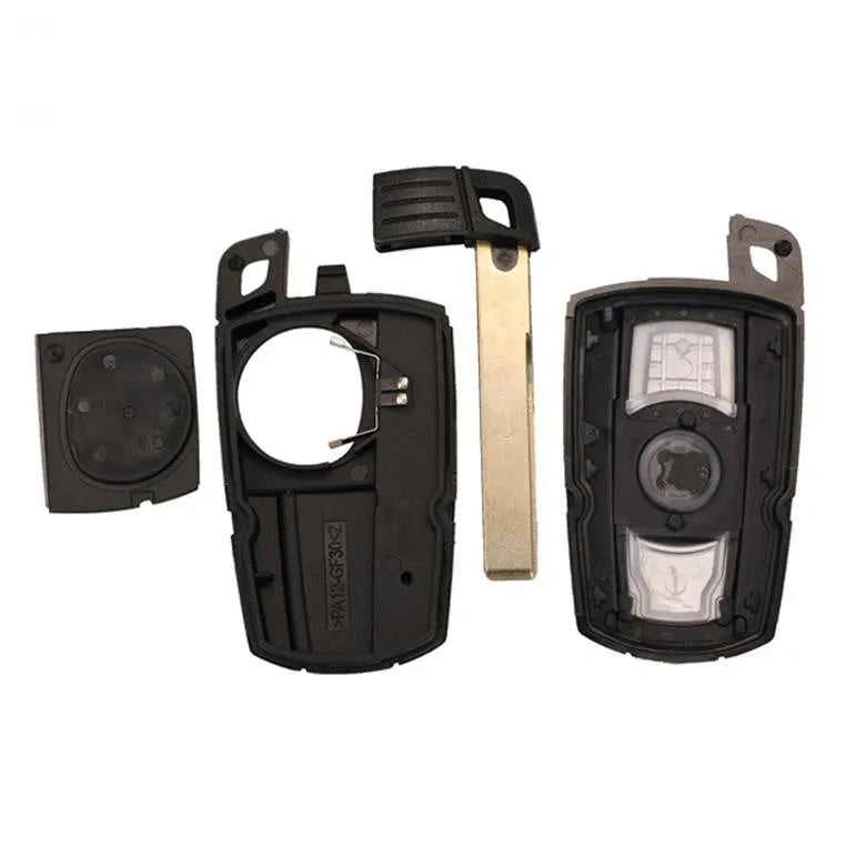 Set of three black BMW CAS3 semi-intelligent remote control car keys on a white background.
