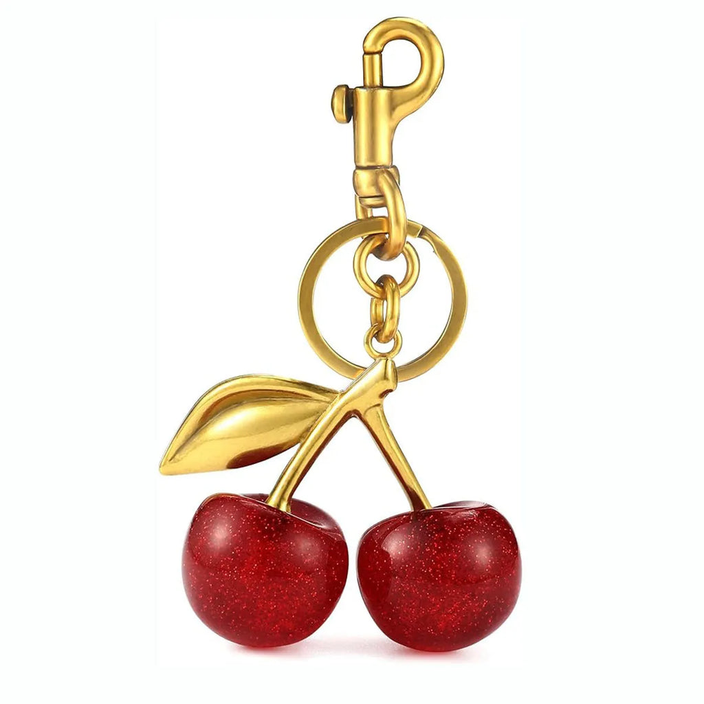 Three-dimensional zinc alloy key ring pendant in pink colour on bag strap