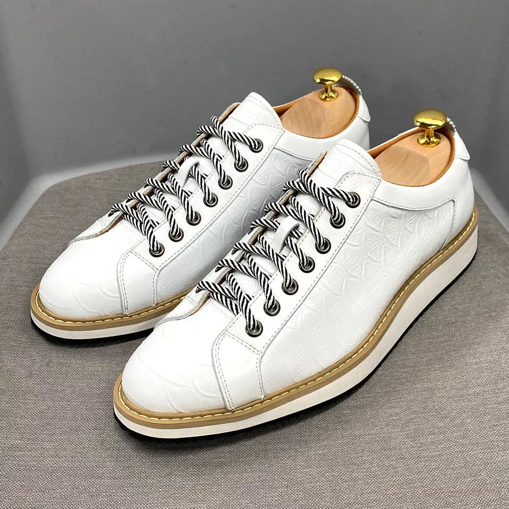 Men's low-top handmade shoes with an embossed pattern, shown in multiple colours with front lace-up detail.