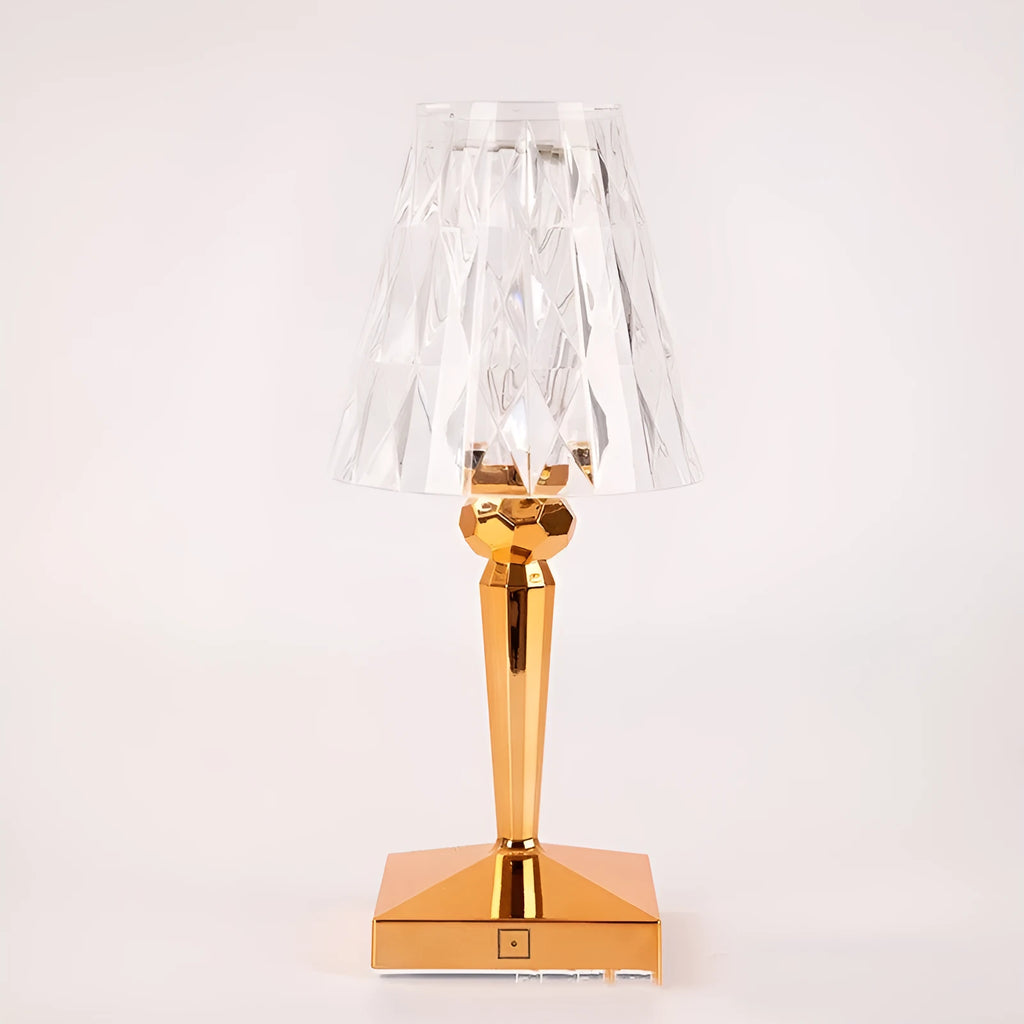 Portable rose gold touch control night light with acrylic lamp holder on a table.