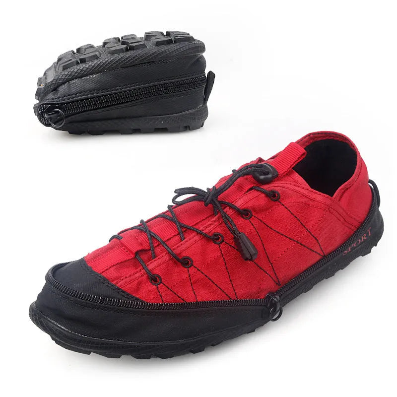 Orange foldable river trekking shoes with mesh upper and side zipper, shown compressed for storage.