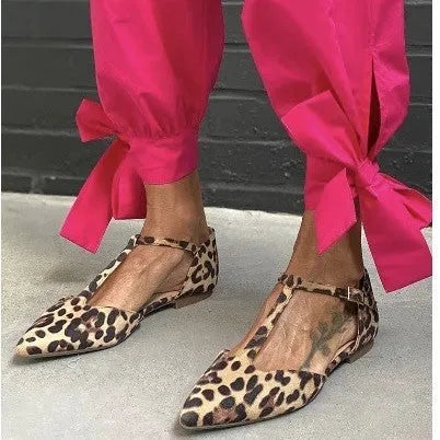 Leopard print women's pumps with pointed toe, chunky low heel, and ankle cross strap.