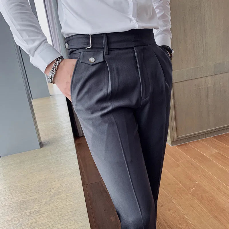 Men's straight-leg casual trousers in solid colours including black and grey, laid flat.