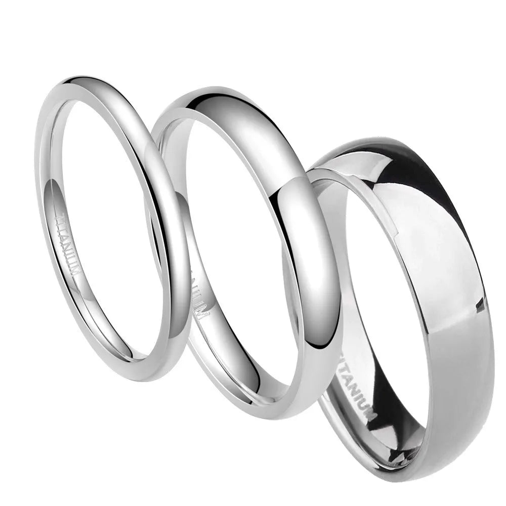 Silver-coloured plain titanium band ring shown in three different widths: 2mm, 4mm, and 6mm.