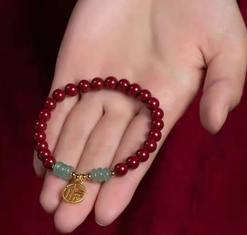 Gold cinnabar wave bracelet with copper bead on wrist, unisex national style
