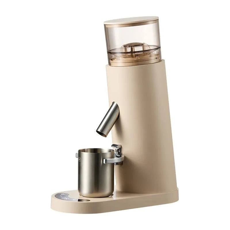 Automatic stainless steel coffee grinder machine in beige colour on a countertop.