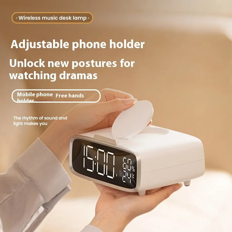 White ABS acrylic Bluetooth speaker wireless charger with night lamp and alarm clock on a desk showing charging pad and speaker grille