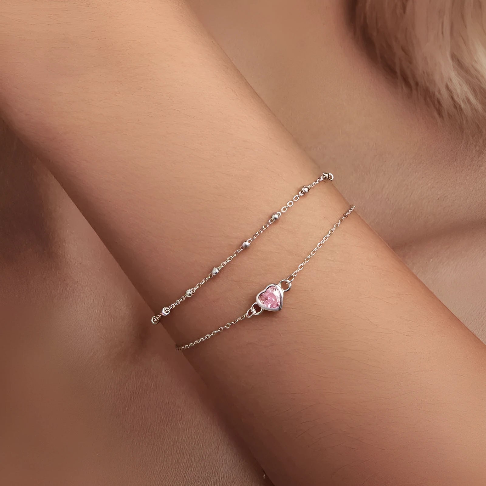 Sweet girlish sterling silver bracelet with a small heart-shaped pendant on an adjustable chain.