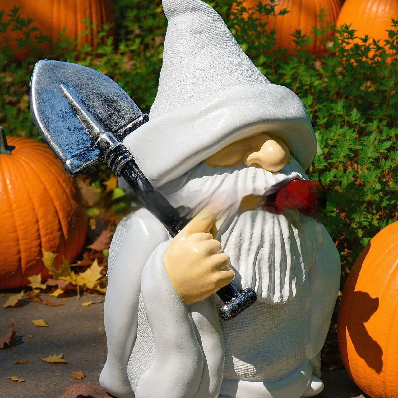 Resin Christmas ornament depicting pipe dwarf with smoking shovel accessory for festive decoration