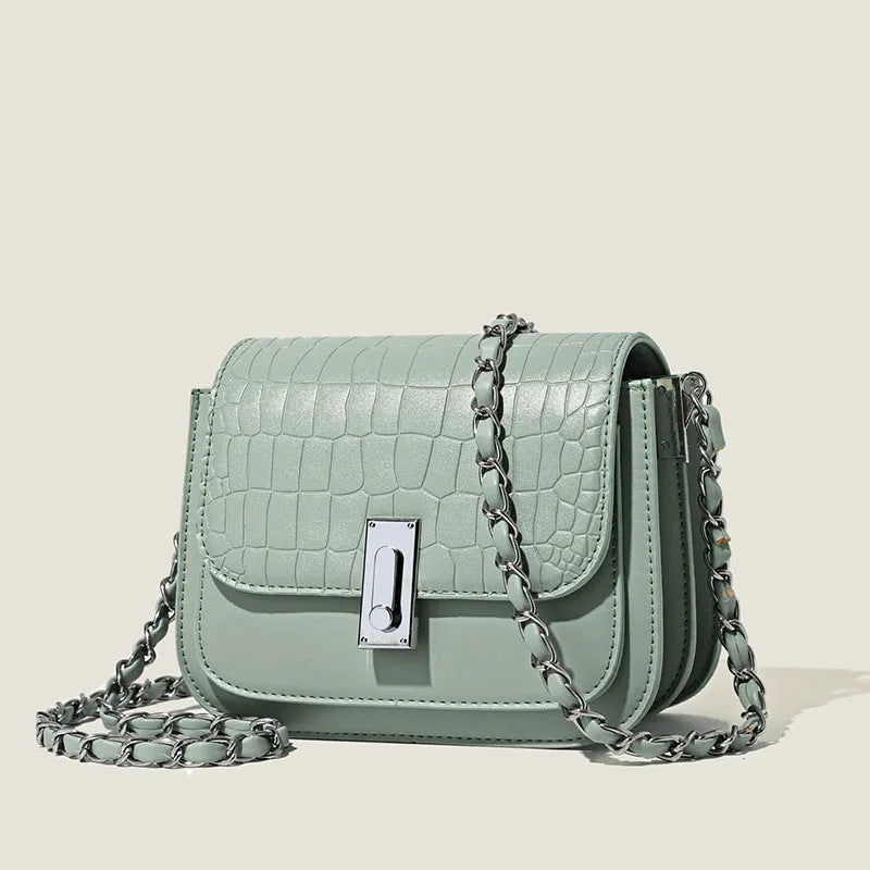 Women's black PU leather shoulder bag with chain strap showing internal phone pocket