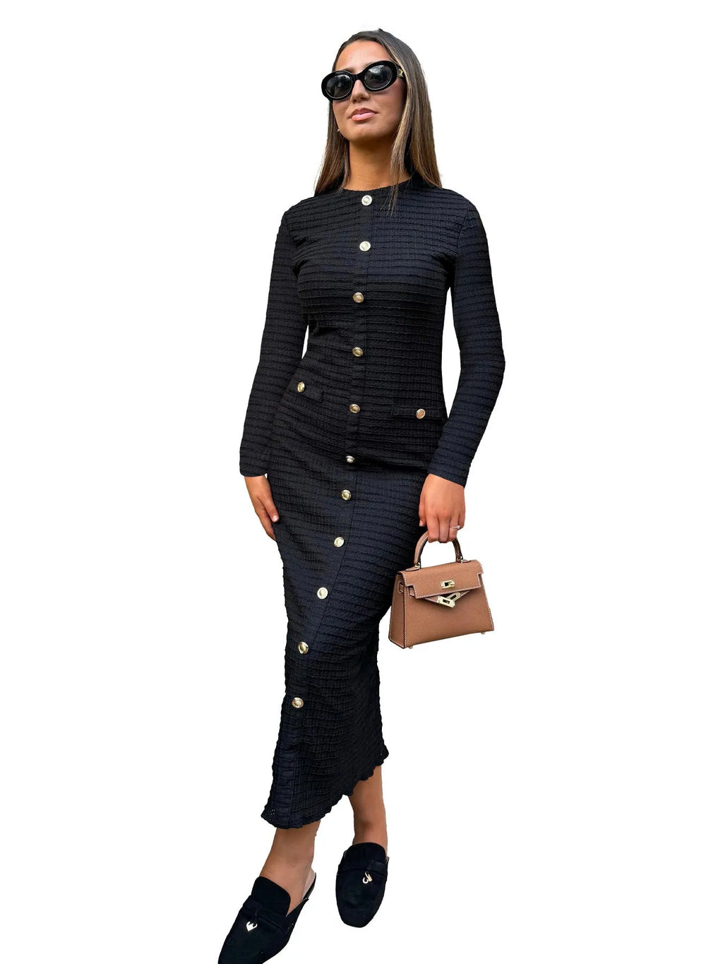 Black and white French retro slim fit knitted long-sleeved dress with button detail.