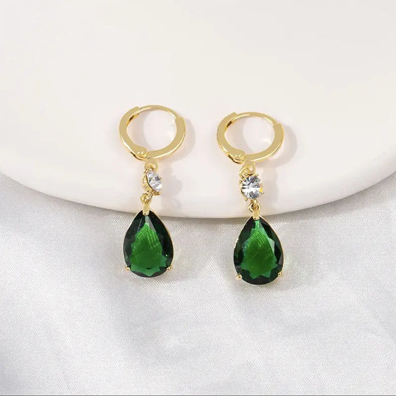 A pair of green geometric teardrop earrings made from alloy metal.