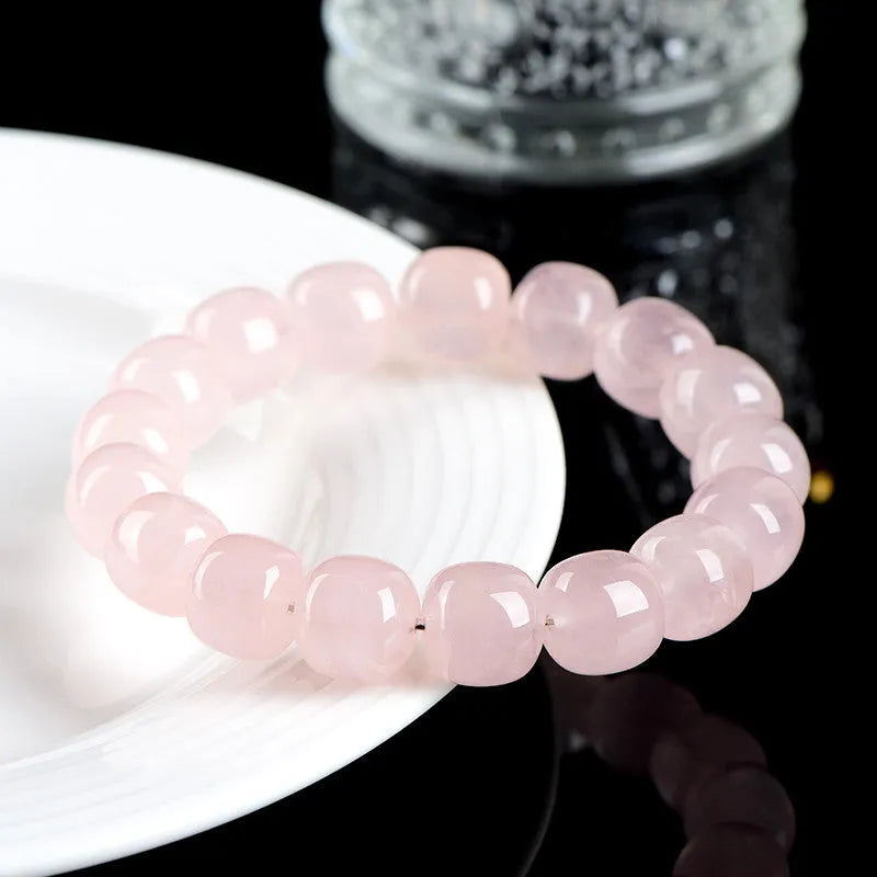 Pink crystal barrel bead bracelet with geometric design and 11-12mm beads