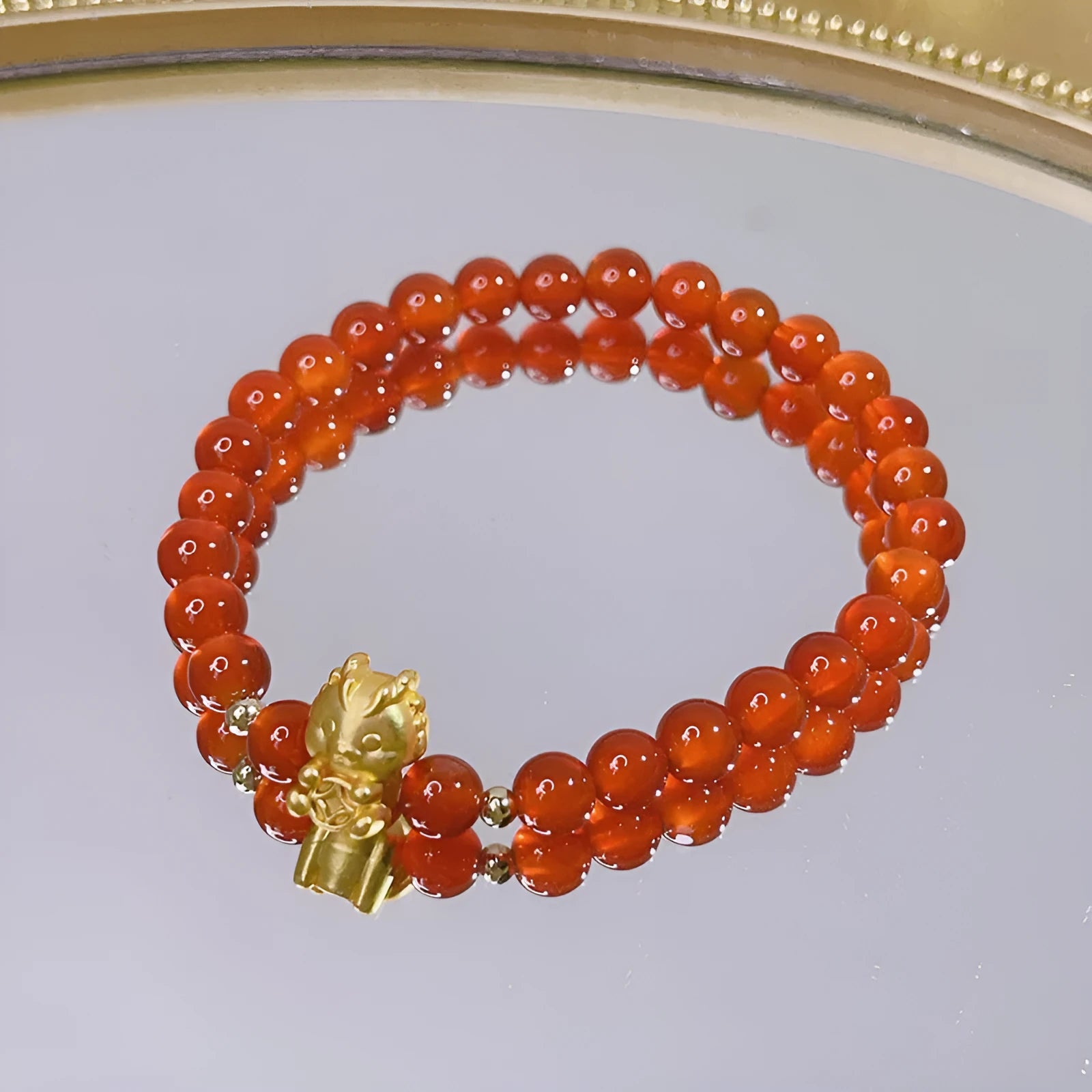 Red agate bracelet for women with Chinese style dragon motif, handmade from natural stone