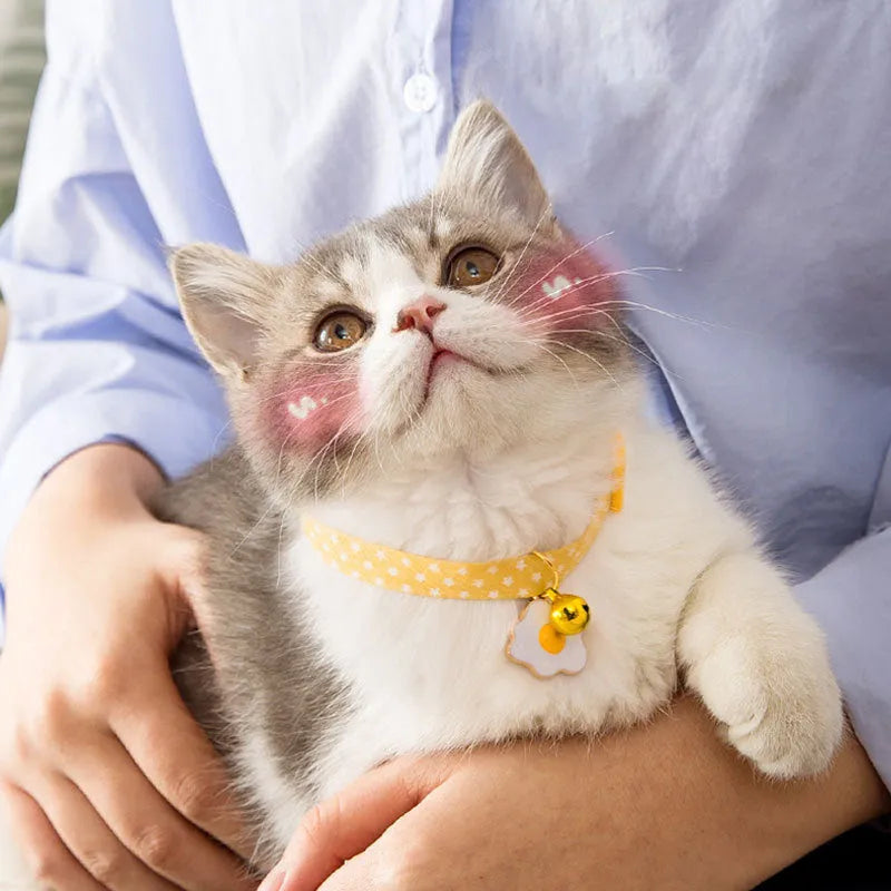Adjustable cat collar with bell pendant and bow tie accessory in green, pink, or yellow colours