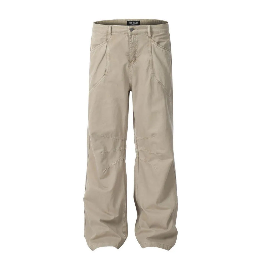 Men's brown loose straight-leg cotton trousers with a high waist and zipper fly.