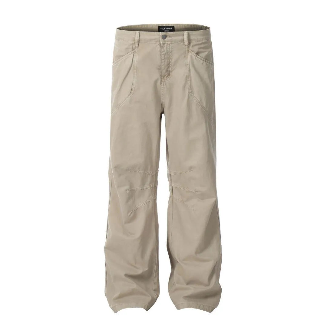 Men's brown loose straight-leg cotton trousers with a high waist and zipper fly.