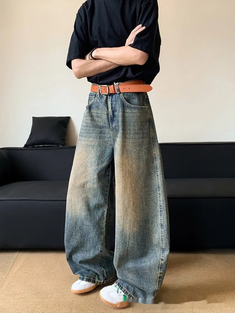 Men's retro blue distressed denim wide-leg pants with vintage styling and slimming silhouette
