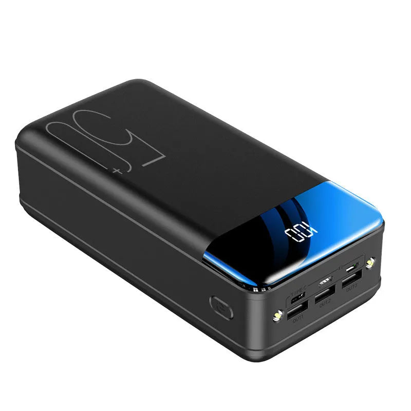 Large black power bank showing three output ports and display screen measuring 169mm