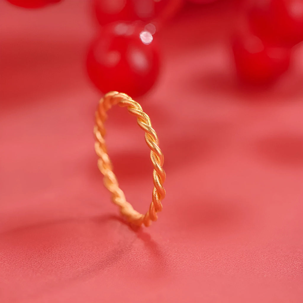 Simple bracelet brass gold plated ring in glossy finish on white background