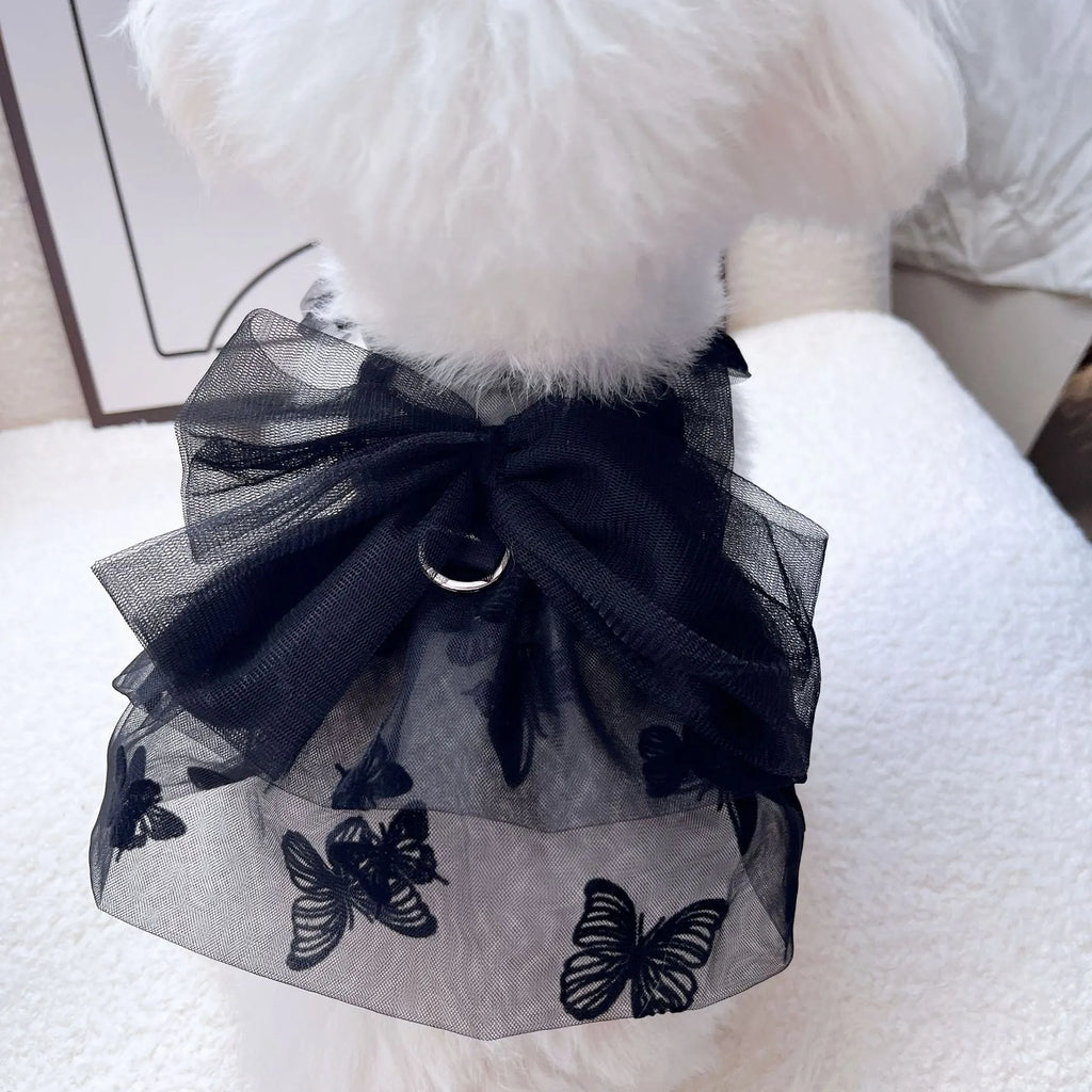Black tulle princess skirt costume on small dog, showing tiered gauze design and adjustable fit.