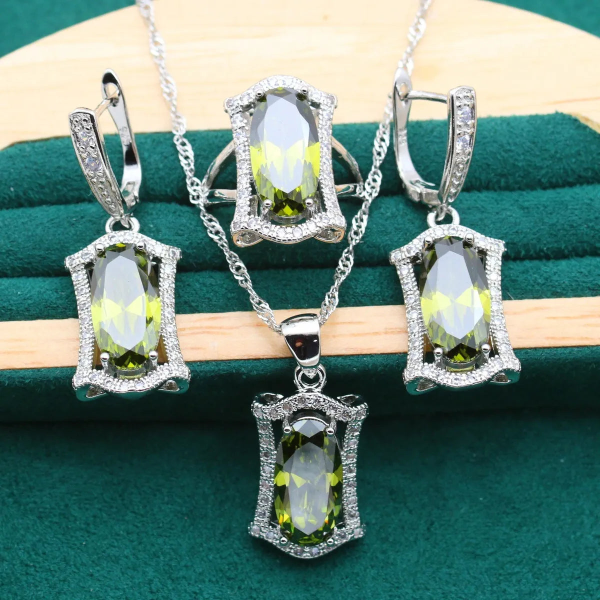 Yellow anti-allergy zircon jewellery set showing necklace, earrings, ring, and bracelet on a snake bone chain.