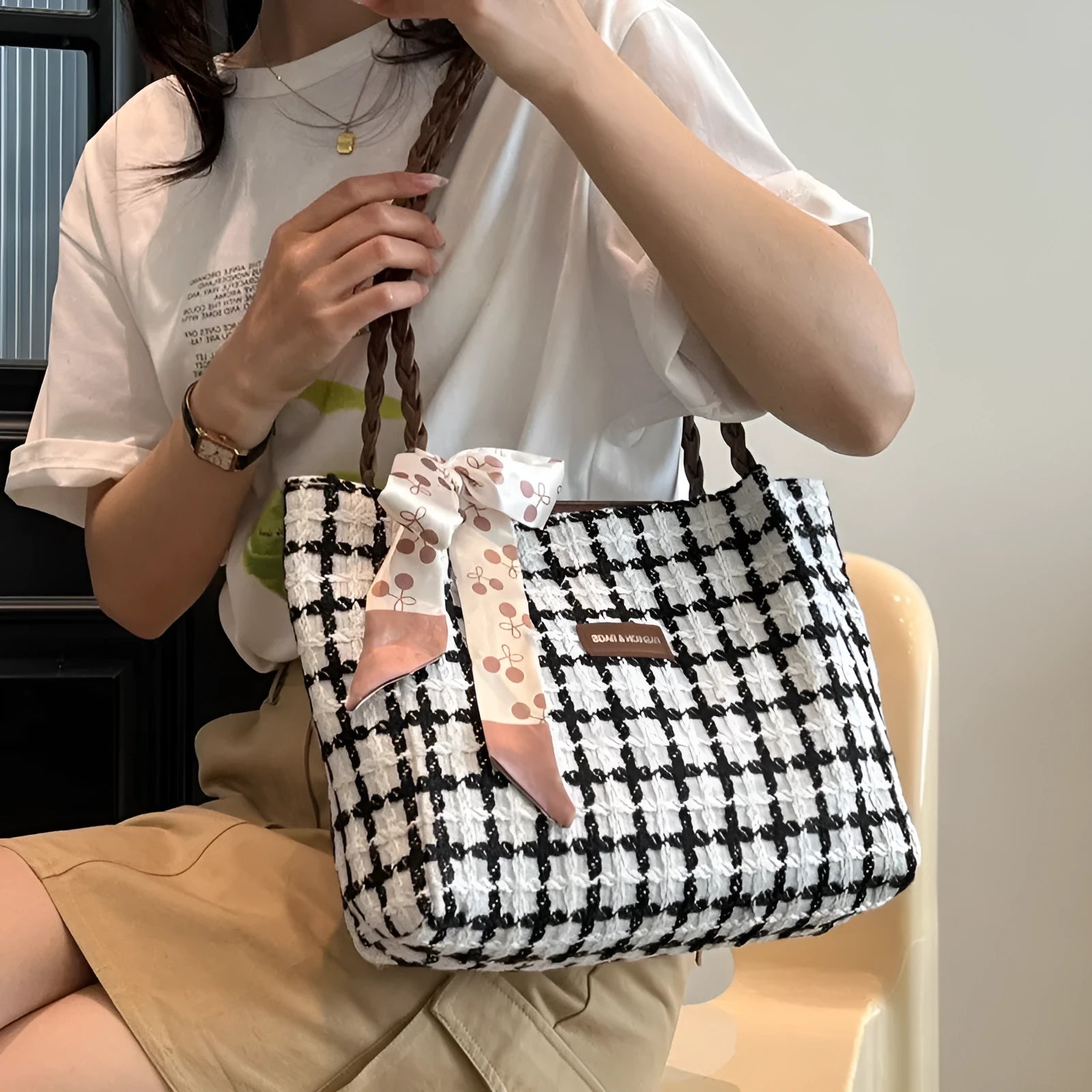 Woolen shoulder bag in black with horizontal square shape and sandwich pocket for commuting and shopping use