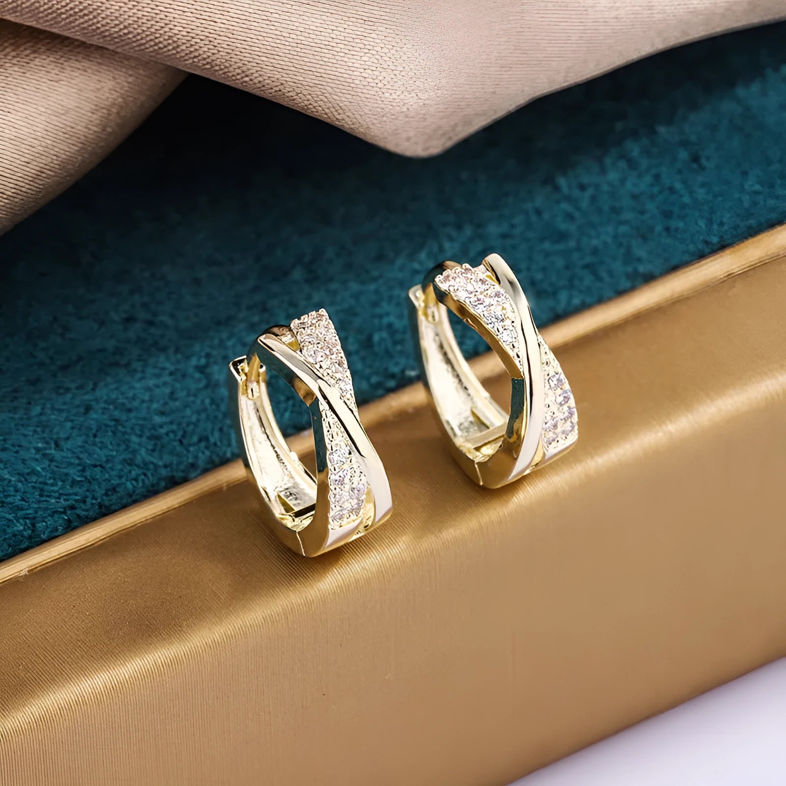 Geometric copper earrings with 14K yellow finish and zircon treatment.