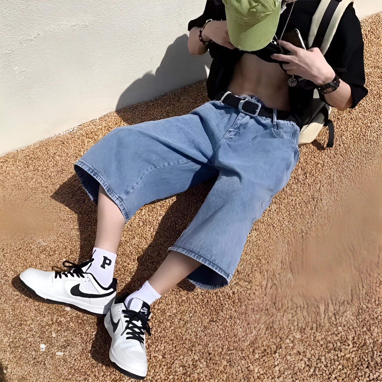 Blue men's denim pirate shorts with high waist, cropped length, and straight legs on a mannequin.