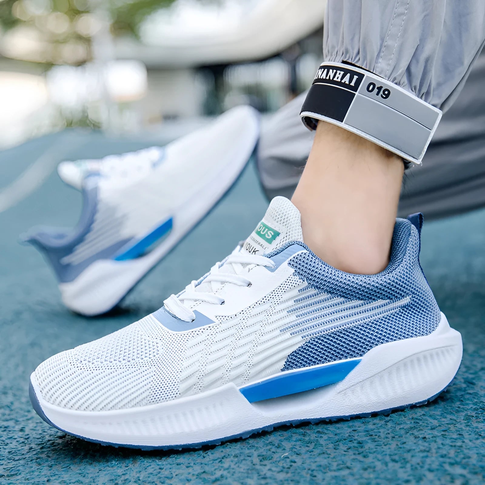 Men's blue breathable mesh casual shoe with round toe and injection moulded sole.