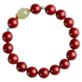 Purple Gold Sand cinnabar Hetian jade bead bracelet in geometric elliptical shape on wrist.