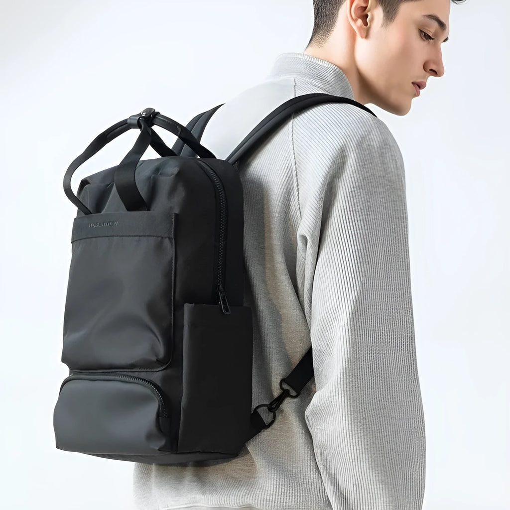 Lightweight black oxford cloth computer backpack with a 20-35 litre capacity.