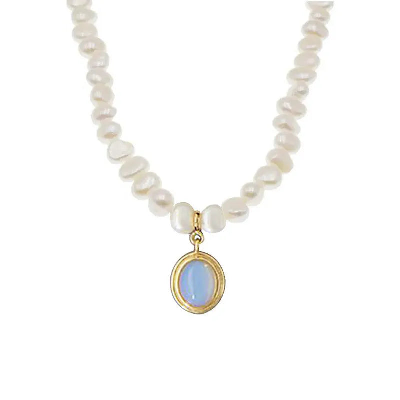 Close-up of a round 925 sterling silver necklace with an irregular geometric pearl pendant on a white background.