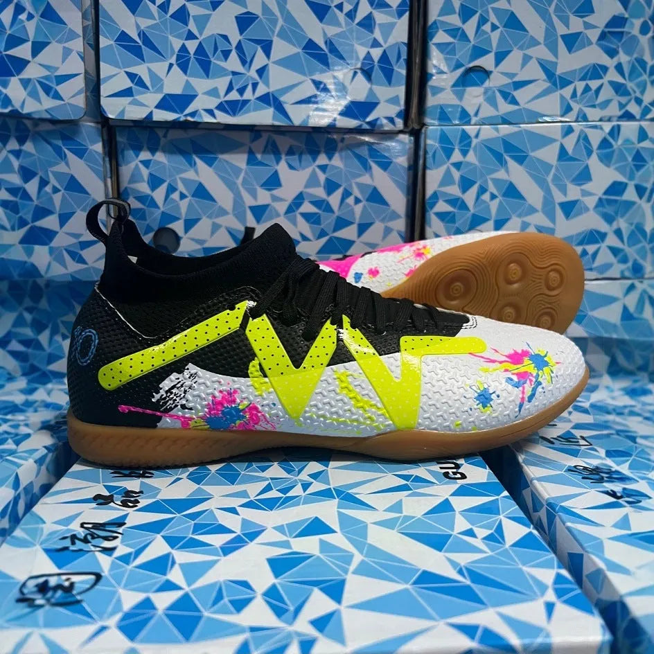 Adult low-top football boots with a PVC upper and rubber studded outsole, shown in black and yellow.