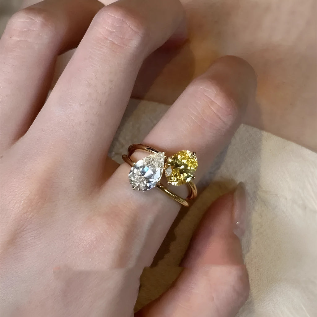 Copper geometric open ring with water drop design and double sheng stone colour contrast.