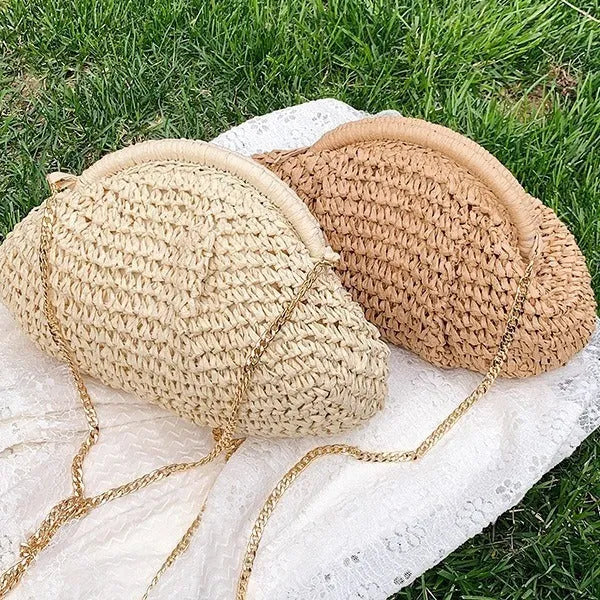 Khaki shell-shaped straw shoulder bag for women with chain detail and zippered pocket.