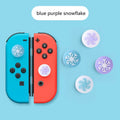 Set of four silicone cat claw keycaps for Nintendo Switch Lite joycons in assorted colours.