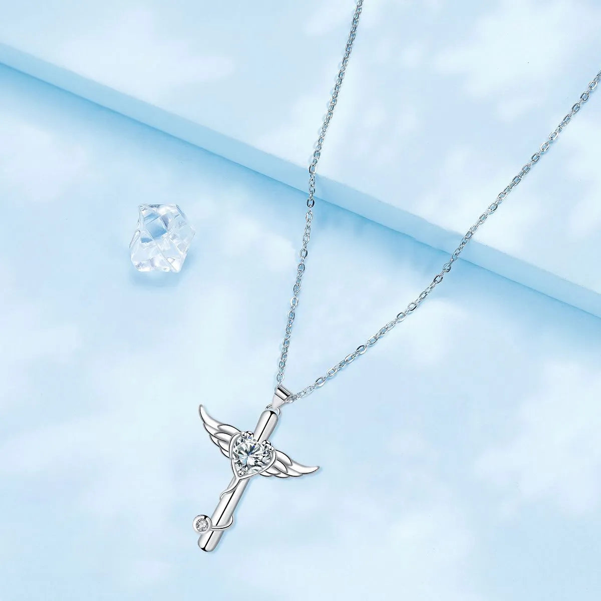 Wings cross stethoscope pendant necklace in copper with electroplated white or red diamond finish.
