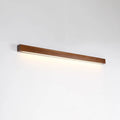 Slim walnut-colour wood and acrylic LED strip wall lamp in three length options on a white wall.
