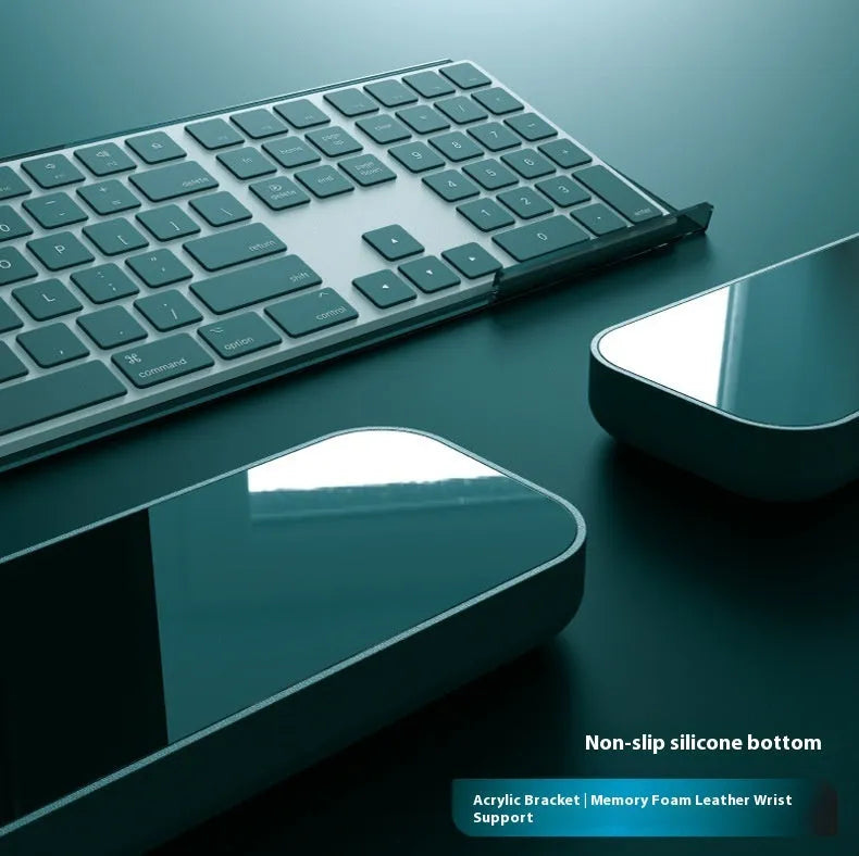 Memory foam keyboard and mouse pad with wrist rest in various colours on a desk