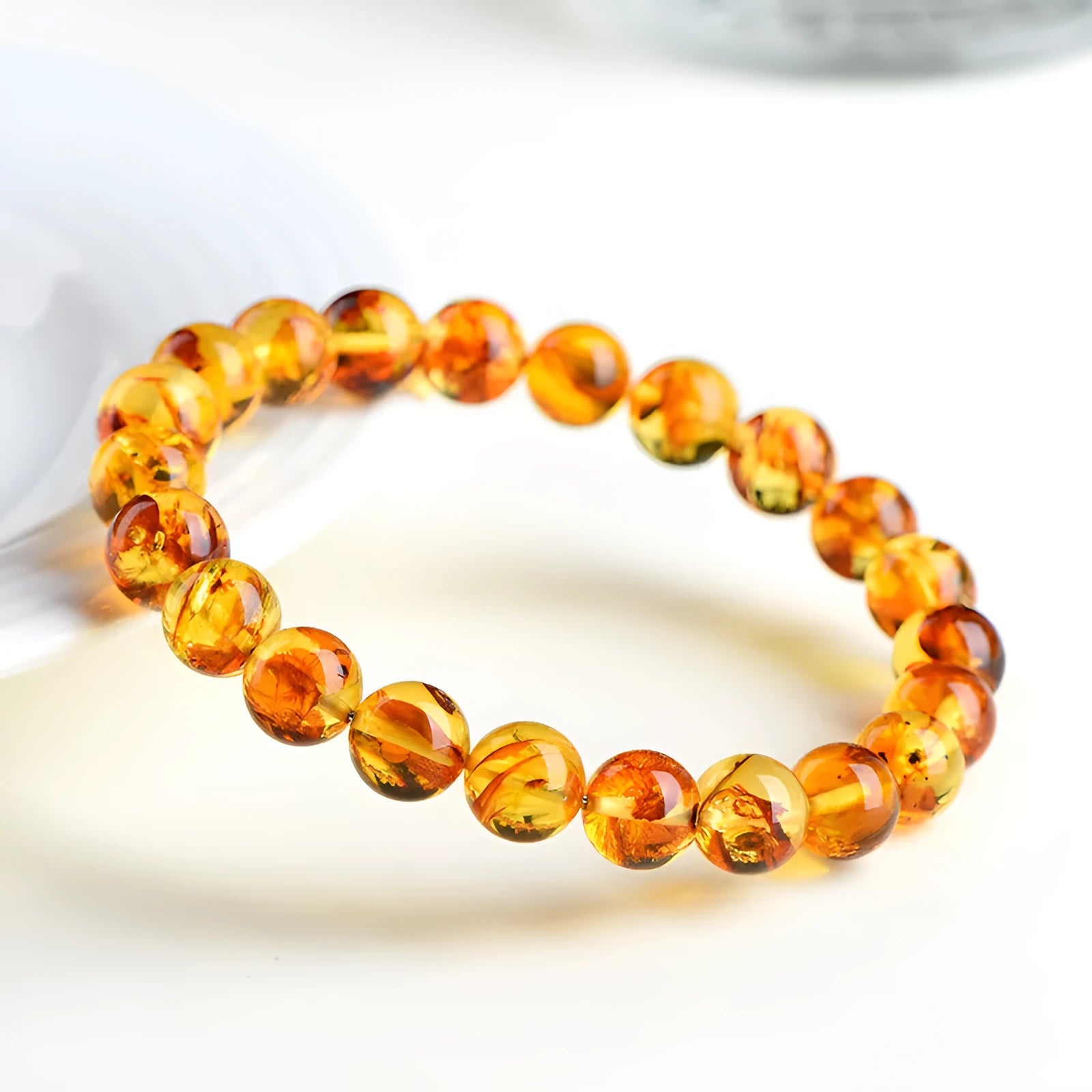 Natural yellow piebald amber bracelet with flower spot patterning and geometry beads