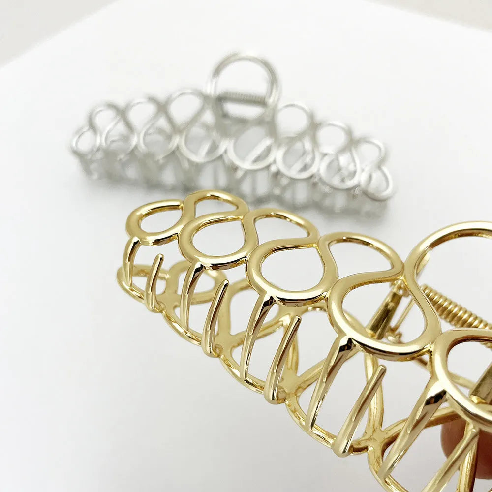 Updo minimalist large hair clip in gold, alloy with electroplated finish and tassel detail