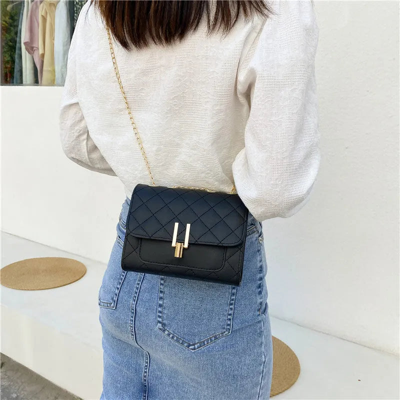 Women's diamond lattice chain crossbody bag in black, green or white with adjustable strap