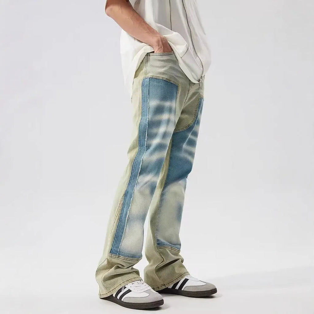 Retro yellow and blue patchwork jeans with splash-ink damaged design detail