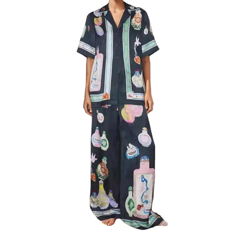 Black women's cartoon print polyester lounge set with cardigan sleeve top and matching trousers