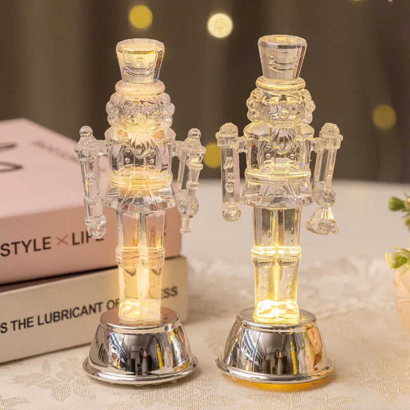 Transparent plastic walnut soldier Christmas nutcracker ornament on a desk.