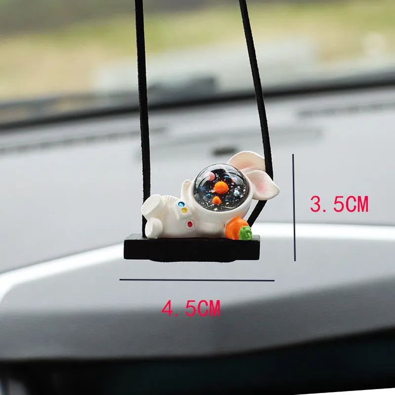 Resin astronaut car pendant with hand-painted cartoon designs in five colour variations