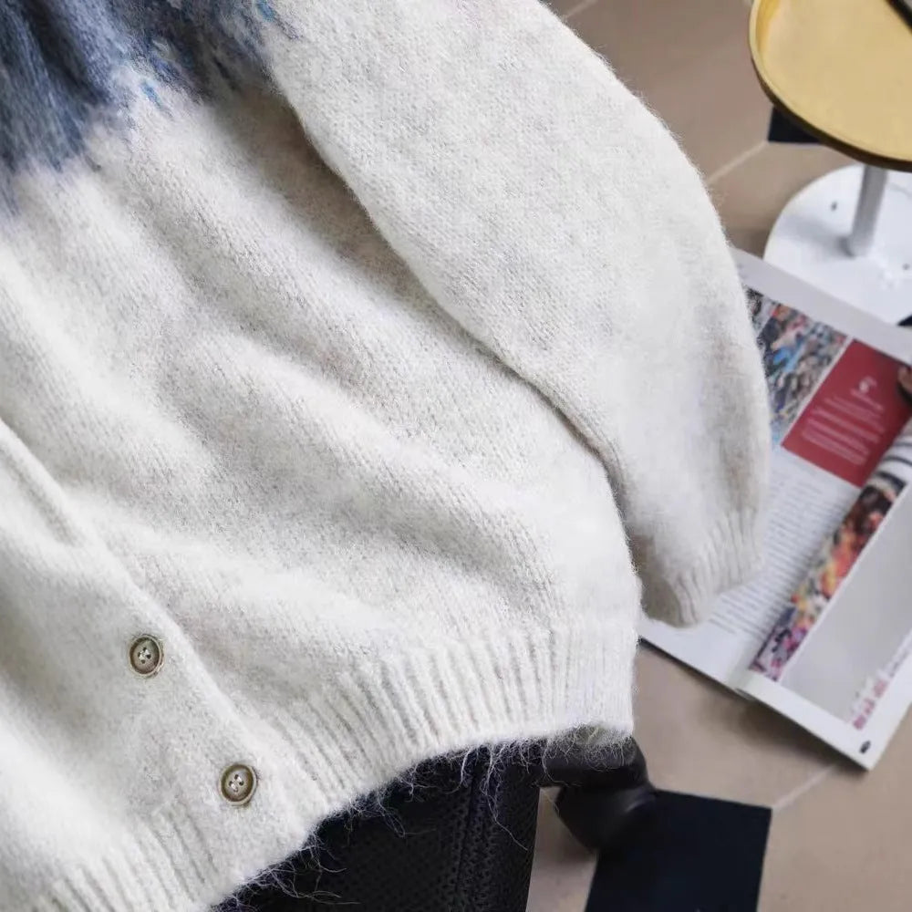Women's loose-fit jacquard sweater coat in milky white, shown with long sleeves and a textured pattern.