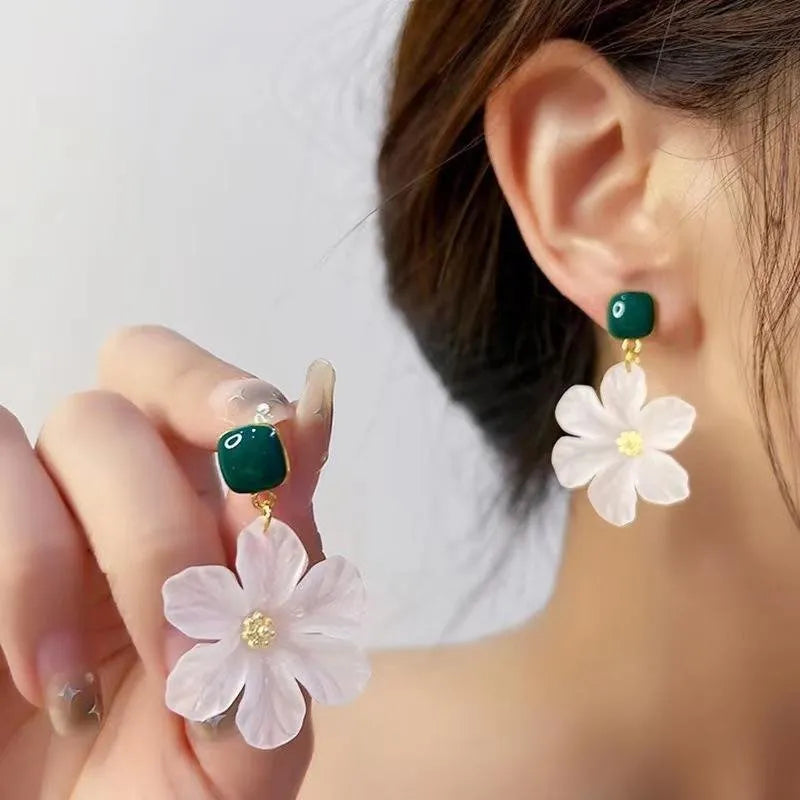Dark green floral drop earrings with alloy construction and sterling silver fastening